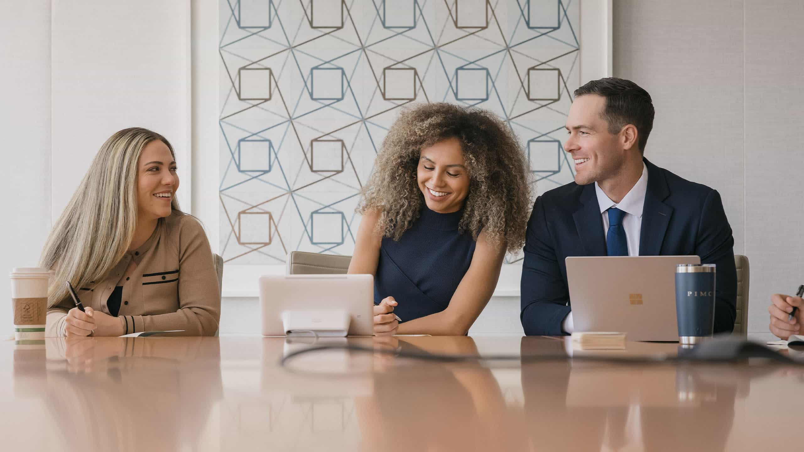 Young professional talking during a meeting.