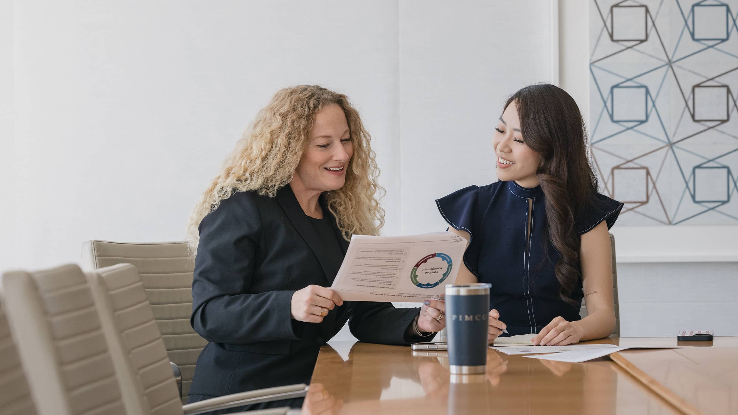 2 people at computer monitor